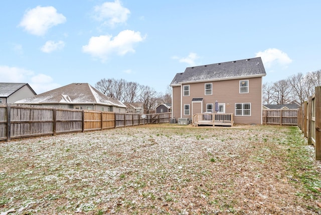 back of house featuring a wooden deck and central AC