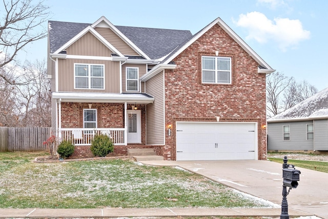 view of front of property featuring covered porch and a garage