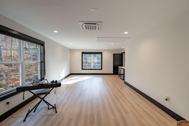 empty room with light hardwood / wood-style floors