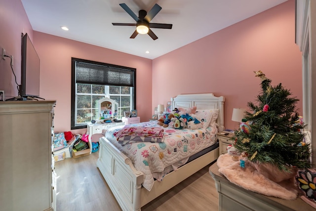 bedroom featuring ceiling fan and light hardwood / wood-style flooring