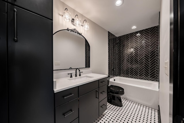 full bathroom with toilet, vanity, tile patterned flooring, and tiled shower / bath