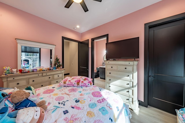 bedroom featuring ceiling fan and light hardwood / wood-style flooring