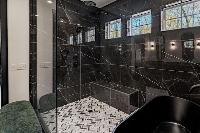 bathroom featuring shower with separate bathtub