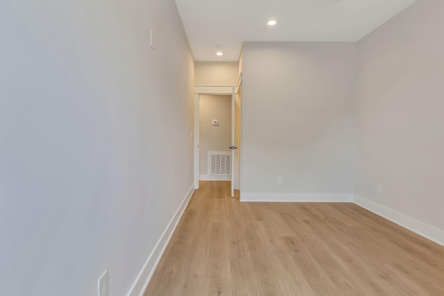 spare room with light wood-type flooring