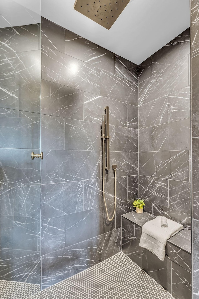 full bathroom with tiled shower