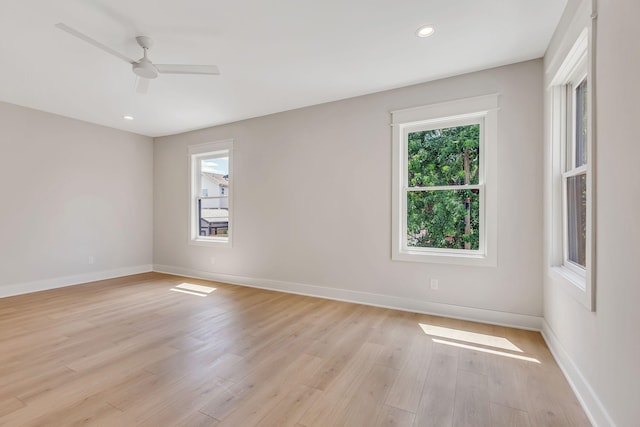 unfurnished room with light wood-type flooring and ceiling fan