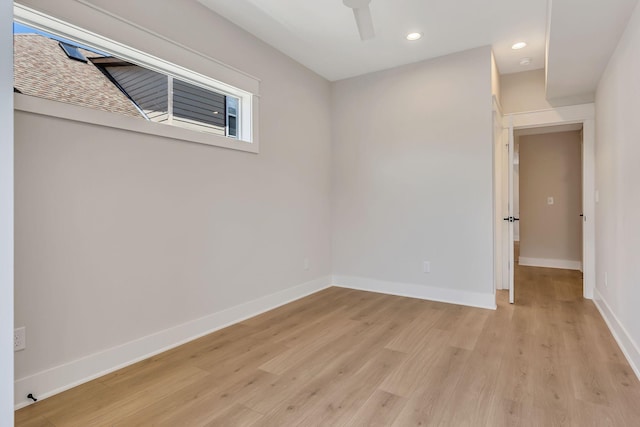 spare room with light wood-type flooring