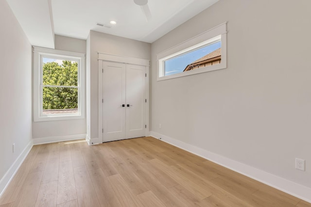 interior space with visible vents, baseboards, a healthy amount of sunlight, and light wood-style flooring