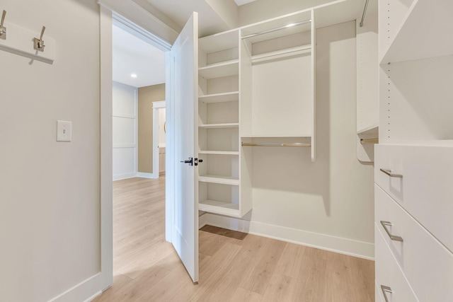 walk in closet featuring light wood-type flooring