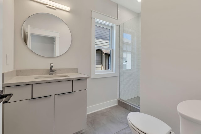 full bathroom featuring baseboards, toilet, a stall shower, tile patterned floors, and vanity