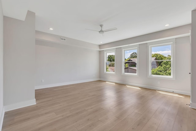 unfurnished room with visible vents, a ceiling fan, recessed lighting, light wood-style floors, and baseboards