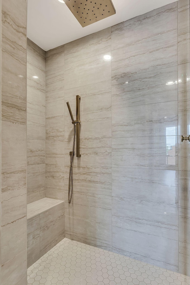 bathroom with a tile shower