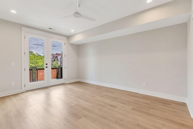 unfurnished room featuring visible vents, light wood-style flooring, french doors, and baseboards