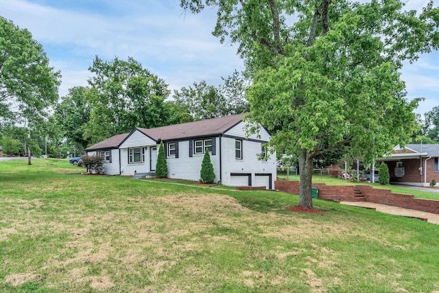 single story home with a front yard and a garage