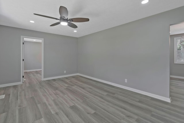 unfurnished room featuring ceiling fan and light hardwood / wood-style floors