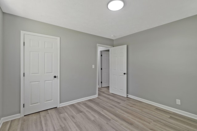 unfurnished bedroom featuring light hardwood / wood-style floors