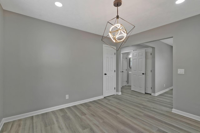 unfurnished dining area with light wood-type flooring