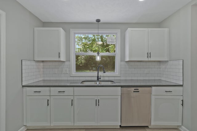 kitchen featuring white cabinetry, dishwasher, sink, backsplash, and decorative light fixtures