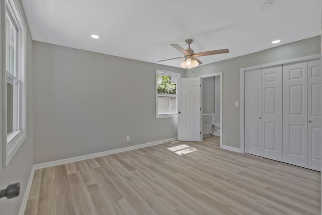 unfurnished bedroom featuring ceiling fan and light wood-type flooring