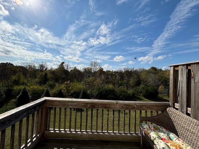 wooden deck with a yard