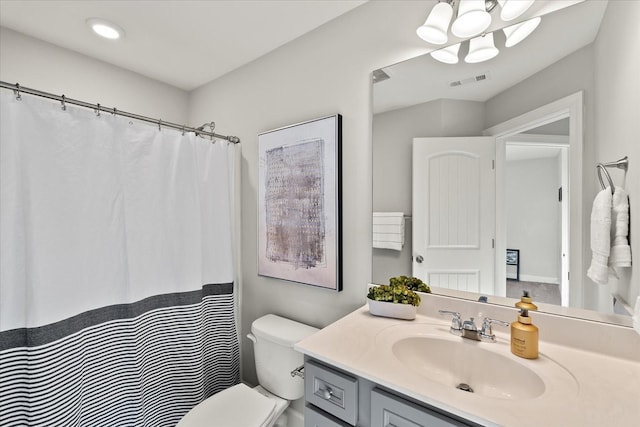 bathroom featuring vanity and toilet