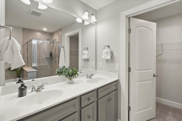 bathroom with vanity and an enclosed shower