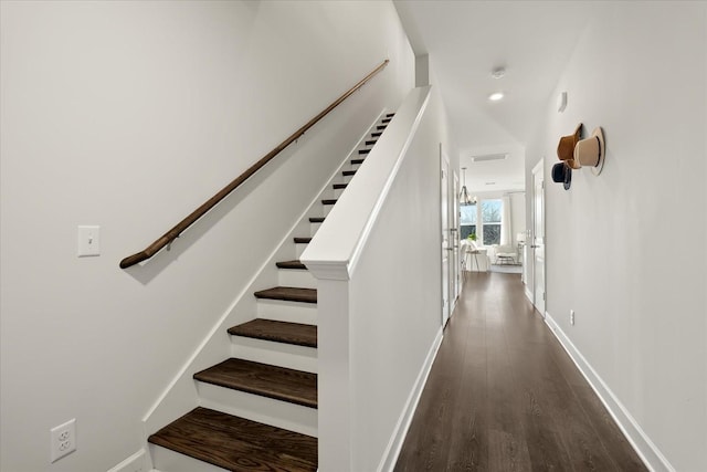 stairway featuring hardwood / wood-style flooring