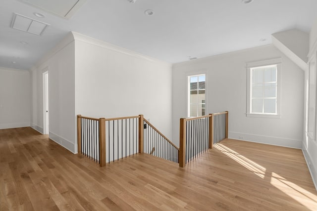 additional living space featuring light hardwood / wood-style flooring