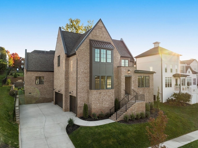 view of front facade featuring a garage and a front lawn