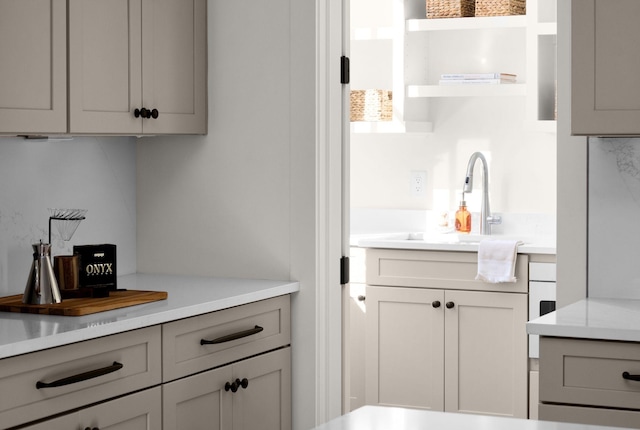 interior space with decorative backsplash and sink