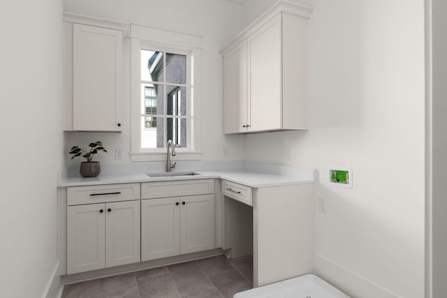 kitchen with white cabinets and sink