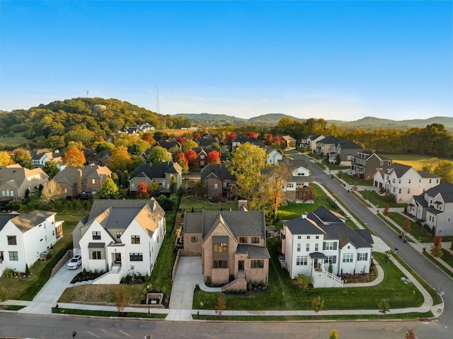 birds eye view of property with a mountain view