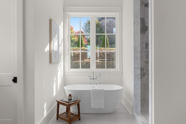 bathroom featuring tile patterned floors and plus walk in shower