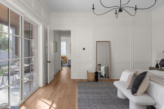 interior space featuring light hardwood / wood-style floors and an inviting chandelier