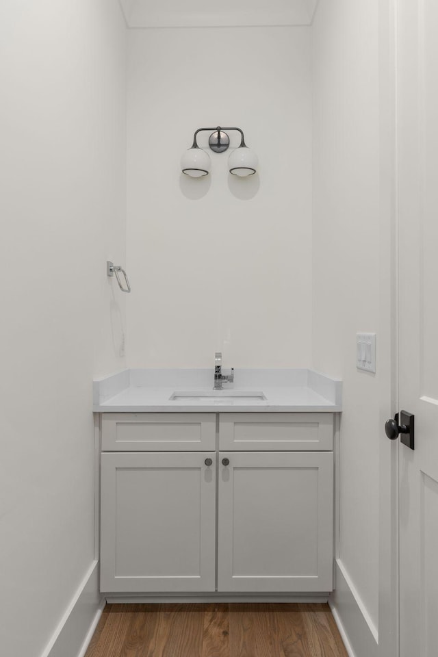 bathroom featuring hardwood / wood-style floors and vanity