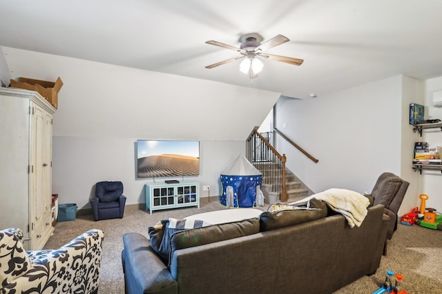 carpeted living room with ceiling fan and lofted ceiling