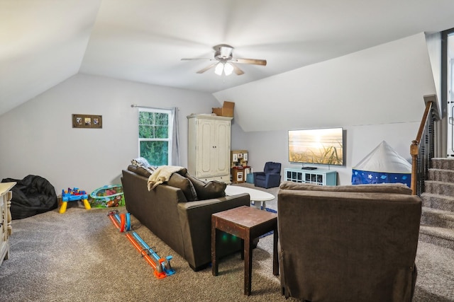 carpeted living room featuring ceiling fan and lofted ceiling