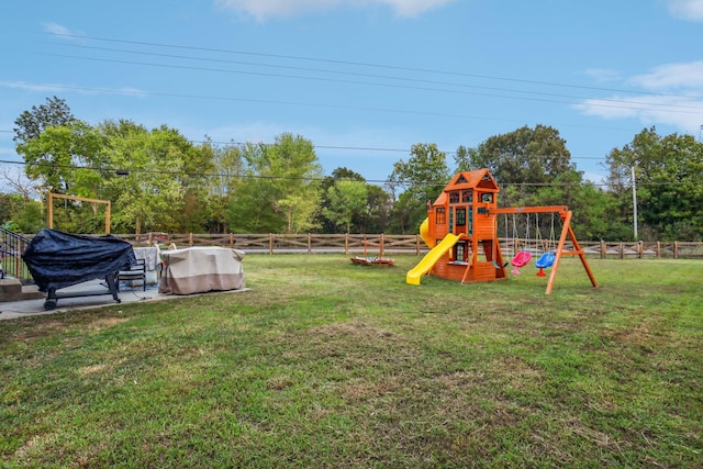 view of playground featuring a lawn