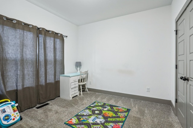 playroom featuring light colored carpet