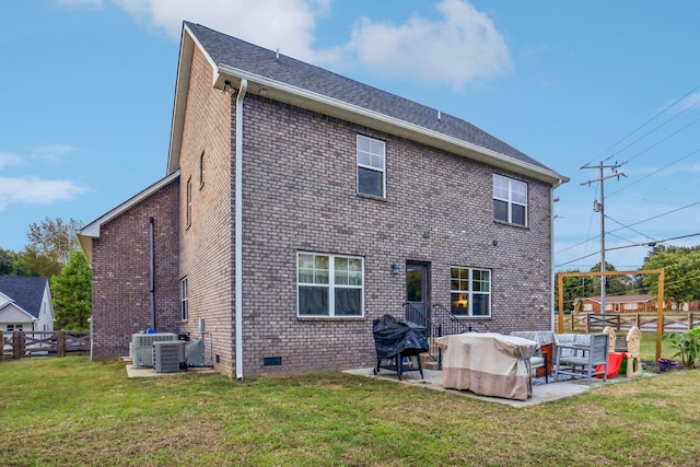 back of property featuring a lawn and a patio area