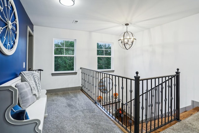 hallway featuring a chandelier