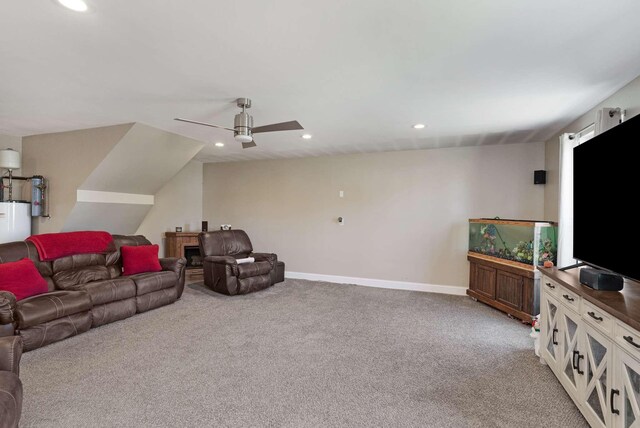 carpeted living room featuring ceiling fan