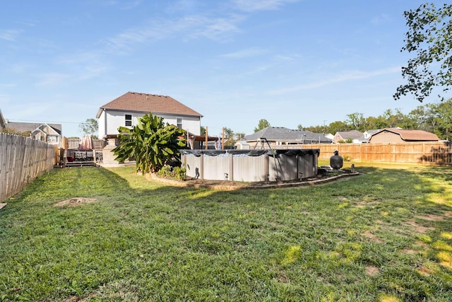 view of yard featuring a covered pool