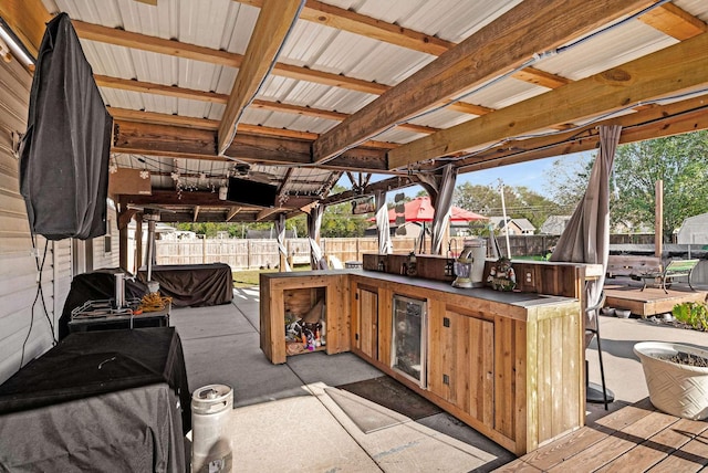 view of patio / terrace featuring an outdoor bar