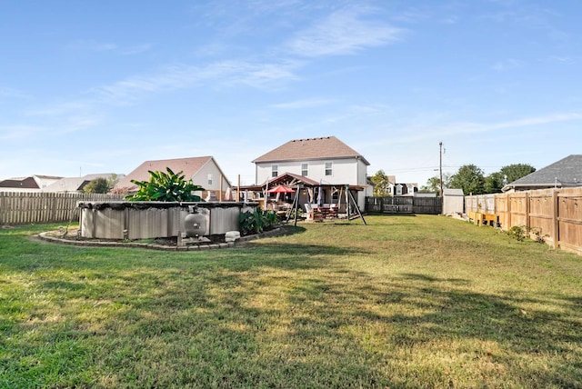 view of yard with a gazebo and a covered pool