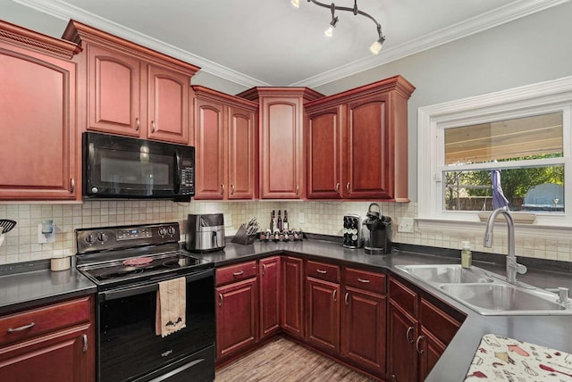 kitchen featuring backsplash, ornamental molding, sink, black appliances, and light hardwood / wood-style floors