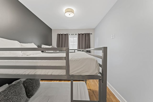 bedroom with wood-type flooring