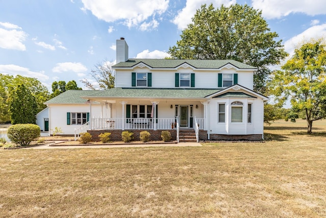 view of front facade with a front lawn and a porch