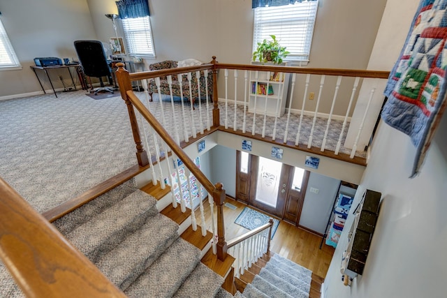 stairway with hardwood / wood-style floors