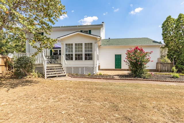 exterior space featuring a deck and a front yard